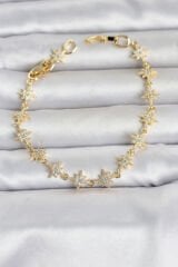 Pirinç Gold Renk Zirkon Taşlı Sıralı Kutup Yıldızı Model Kadın Bileklik